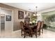 Elegant dining room featuring a decorative wall and chandelier lighting, perfect for hosting gatherings at 18867 N Cactus Flower Way, Surprise, AZ 85387