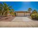 Charming home featuring desert landscaping, palm trees, and a three-car garage at 18867 N Cactus Flower Way, Surprise, AZ 85387