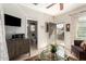 Inviting living room with tiled floors, modern furnishings, an open doorway, and plenty of natural light at 18867 N Cactus Flower Way, Surprise, AZ 85387
