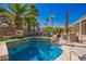Beautiful custom splash pool surrounded by mature trees, stone, and meticulous landscaping, perfect for outdoor enjoyment at 18867 N Cactus Flower Way, Surprise, AZ 85387