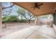 Covered back patio overlooking a fenced-in yard with mature trees at 20838 N 39Th Dr, Glendale, AZ 85308