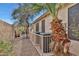 Backyard view shows mature trees, a privacy fence, and lush landscaping, creating a serene outdoor space at 20838 N 39Th Dr, Glendale, AZ 85308