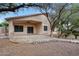 Cozy backyard patio with a ceiling fan, offering a serene outdoor retreat in a landscaped setting at 20838 N 39Th Dr, Glendale, AZ 85308