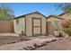 Charming backyard shed with neutral colors and ample storage space in a well-maintained yard at 20838 N 39Th Dr, Glendale, AZ 85308