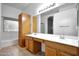 Bathroom with double vanity, tile floors, and built in shelves at 20838 N 39Th Dr, Glendale, AZ 85308