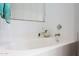 Close-up of a bathtub with a view of the window at 20838 N 39Th Dr, Glendale, AZ 85308