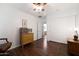 Bright bedroom with wooden floors, closet, and ample natural light, offering a tranquil retreat at 20838 N 39Th Dr, Glendale, AZ 85308
