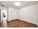 Cozy bedroom featuring wood floors and a closet, perfect for storage at 20838 N 39Th Dr, Glendale, AZ 85308