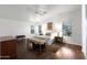 Bedroom features hardwood floors, ceiling fan, and natural light from two windows at 20838 N 39Th Dr, Glendale, AZ 85308