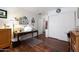Comfortable room with wooden floors, a closet, and a desk, providing an adaptable space at 20838 N 39Th Dr, Glendale, AZ 85308
