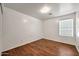 Bright bedroom with warm wood floors and a window providing ample natural light at 20838 N 39Th Dr, Glendale, AZ 85308