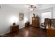 Cozy bedroom with wooden floors, ceiling fan, and classic decor providing a relaxing atmosphere at 20838 N 39Th Dr, Glendale, AZ 85308