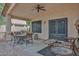 Covered patio with ceiling fan and comfortable seating perfect for outdoor relaxation and entertaining at 20838 N 39Th Dr, Glendale, AZ 85308