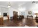 Formal dining room featuring hardwood floors, traditional furnishings, and views into adjacent rooms at 20838 N 39Th Dr, Glendale, AZ 85308