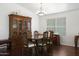 Traditional dining room with wood floors, a large hutch, and a window providing natural light at 20838 N 39Th Dr, Glendale, AZ 85308