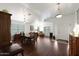 Open-concept living space featuring a dining area with wood floors and ample natural light at 20838 N 39Th Dr, Glendale, AZ 85308