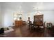 Formal dining room with hardwood floors, traditional furnishings, and a view into adjacent rooms at 20838 N 39Th Dr, Glendale, AZ 85308