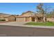 Charming single-story home featuring a well-maintained front yard and a convenient two-car garage at 20838 N 39Th Dr, Glendale, AZ 85308