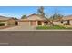 Charming single-story home featuring a well-maintained front yard and a convenient two-car garage at 20838 N 39Th Dr, Glendale, AZ 85308