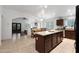 Spacious kitchen featuring a granite island, open dining area, and modern appliances at 20838 N 39Th Dr, Glendale, AZ 85308