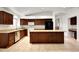 Spacious kitchen with granite countertops, tile flooring, and stainless steel appliances at 20838 N 39Th Dr, Glendale, AZ 85308