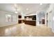 Spacious kitchen with dark wood cabinets, tile flooring and breakfast bar perfect for entertaining at 20838 N 39Th Dr, Glendale, AZ 85308