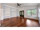 Spacious living room featuring built-in shelving and wood flooring at 20838 N 39Th Dr, Glendale, AZ 85308