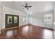 Bright and open living room with wood floors and custom double doors at 20838 N 39Th Dr, Glendale, AZ 85308