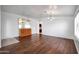 Living room with wood floors, neutral paint, and a mirrored buffet at 20838 N 39Th Dr, Glendale, AZ 85308