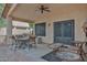 Covered patio with ceiling fan and seating area, perfect for enjoying the outdoors at 20838 N 39Th Dr, Glendale, AZ 85308