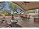 Covered patio area with comfortable seating, perfect for outdoor relaxation and enjoying the backyard at 20838 N 39Th Dr, Glendale, AZ 85308