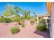 Beautiful backyard with desert landscaping, a covered patio, and a cozy outdoor seating area at 22236 N Arrellaga Dr, Sun City West, AZ 85375