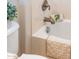 Bright bathroom with brushed metal fixtures and tan and white decor at 22236 N Arrellaga Dr, Sun City West, AZ 85375
