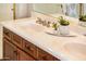 A bathroom vanity with double sinks and white countertop at 22236 N Arrellaga Dr, Sun City West, AZ 85375