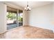 Bright dining area with sliding glass doors providing natural light and access to the outdoor area at 22236 N Arrellaga Dr, Sun City West, AZ 85375