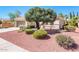 Beautiful one-story home with desert landscaping, a well-manicured lawn, and an attached two-car garage at 22236 N Arrellaga Dr, Sun City West, AZ 85375