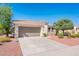 Lovely single-story home with a two-car garage, mature landscaping, and a spacious driveway at 22236 N Arrellaga Dr, Sun City West, AZ 85375