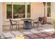 Back patio with outdoor table, chairs, and heater at 22236 N Arrellaga Dr, Sun City West, AZ 85375