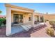 Covered patio area featuring a grill, modern pergola, and access to the home through sliding glass doors at 22236 N Arrellaga Dr, Sun City West, AZ 85375