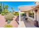 Comfortable patio with pergola and outdoor seating, surrounded by beautiful desert landscaping at 22236 N Arrellaga Dr, Sun City West, AZ 85375