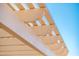Close up of a white painted pergola with blue sky in the background at 22236 N Arrellaga Dr, Sun City West, AZ 85375