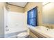 A bathroom with a blue curtain and a white tiled shower at 255 S 92Nd Pl, Mesa, AZ 85208