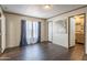 Bright bedroom featuring modern flooring and an en-suite bathroom at 255 S 92Nd Pl, Mesa, AZ 85208