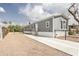 Charming single-story home with neutral paint, gravel yard, and long driveway at 255 S 92Nd Pl, Mesa, AZ 85208