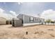 A gray home exterior with a detached storage shed and a desert landscape at 255 S 92Nd Pl, Mesa, AZ 85208