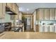 Well-equipped kitchen with ample cabinetry, modern appliances, and a functional layout at 255 S 92Nd Pl, Mesa, AZ 85208