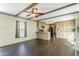 Bright living space with an open floor plan into the kitchen, enhanced by modern dark wood flooring at 255 S 92Nd Pl, Mesa, AZ 85208