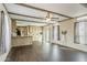 Inviting living area flowing into a kitchen with modern flooring, and natural light at 255 S 92Nd Pl, Mesa, AZ 85208