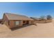 Large backyard with covered patio and block wall fencing at 25536 W Primrose Ln, Buckeye, AZ 85326