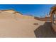 Spacious backyard with block wall fencing and small fire pit at 25536 W Primrose Ln, Buckeye, AZ 85326